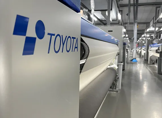 Finished fabric roll packaging and international export staging zone